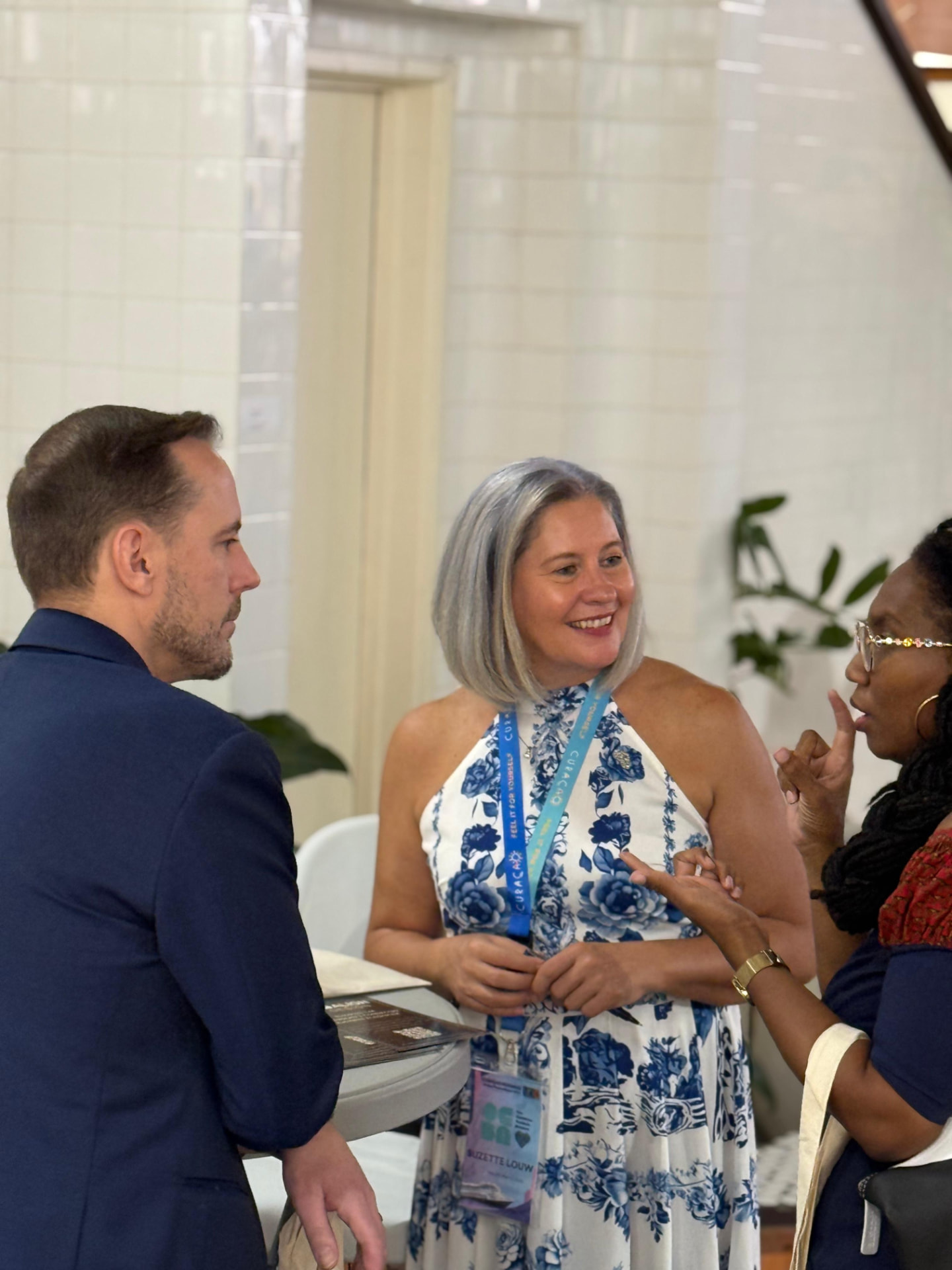 Suzette Louw in conversation at a networking event